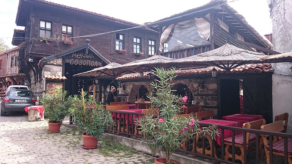 Inside a traditional Bulgarian mehana with folk decoration and wooden furnishings