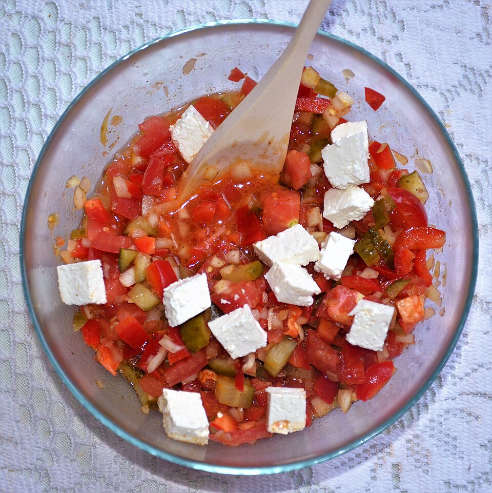 Shopska salad: tomato, cucumber, onion, peppers and grated white cheese
